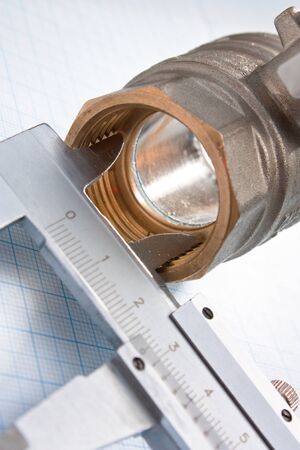 water inlet valve  on a background of graph paperの写真素材