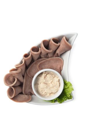 Boiled beef tongue with sauce isolated on white backgroundの写真素材