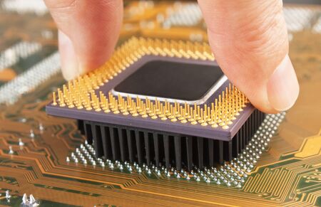 old computer chip processor in the handの写真素材