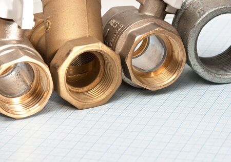 water inlet valve  on a background of graph paperの写真素材