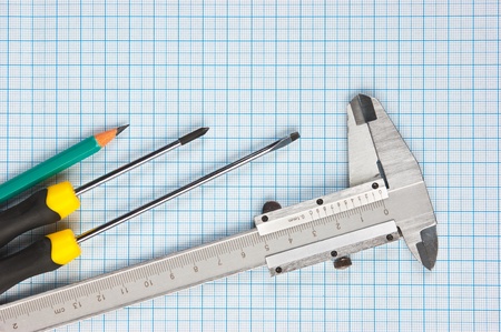 technical tools on a background of graph paperの写真素材