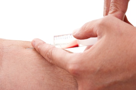 doc makes the patient an injection into a vein   isolated  on a white backgroundの写真素材