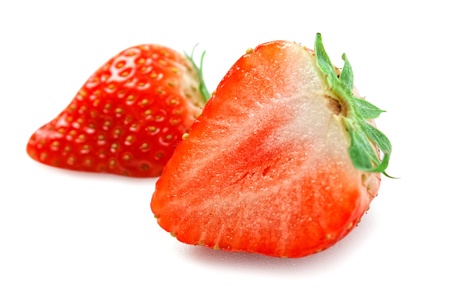 strawberries cut isolated on white backgroundの写真素材
