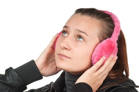 girl teen in pink headphones isolated on whiteの写真素材