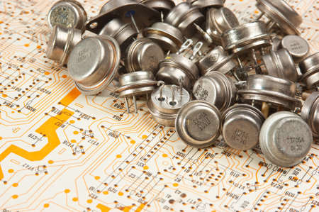 Old electronic components lie on the wiring diagramの写真素材