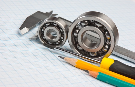 technical tools on a background of graph paperの写真素材