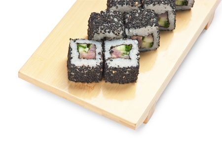Traditional Asian food sushi on wooden plate isolated on white backgroundの写真素材