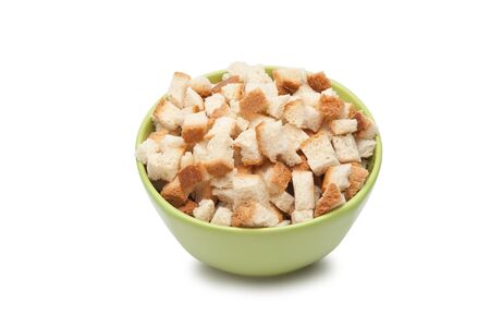grain crackers in green bowl  isolated on white backgroundの写真素材