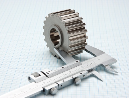 gears and caliper on graph paperの写真素材