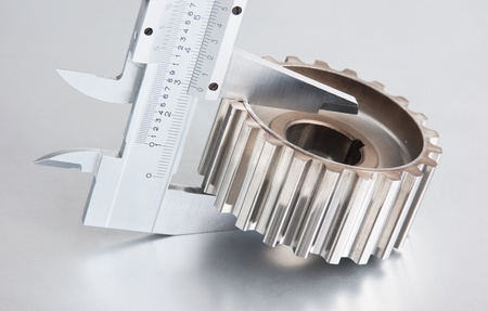 gear and callipers on a metal plateの写真素材