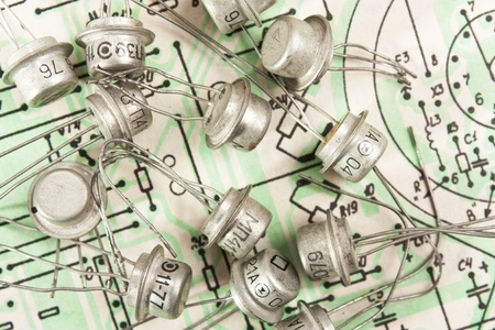 Old electronic components lie on the wiring diagramの写真素材