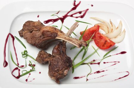 dishes of roast meat with vegetablesの写真素材