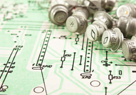 Old electronic components lie on the wiring diagramの写真素材