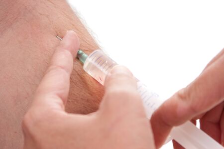 doc makes the patient an injection into a vein isolated  on a white backgroundの写真素材
