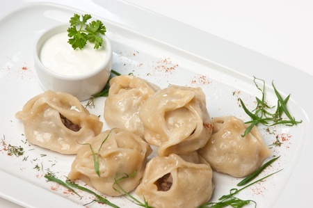 dish of ravioli with sour creamの写真素材