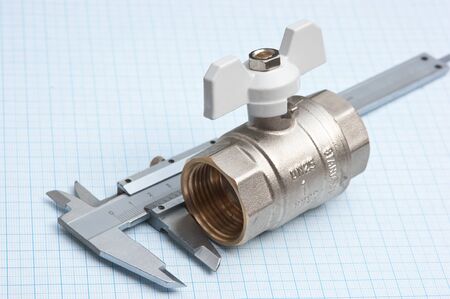 water inlet valve  on a background of graph paperの写真素材