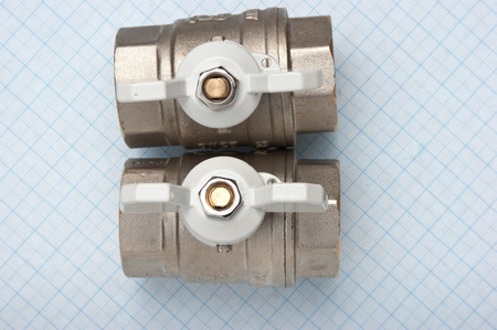 water inlet valve  on a background of graph paperの写真素材
