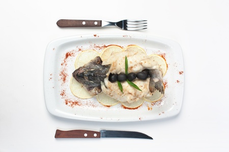 fish baked in pastry with olives の写真素材