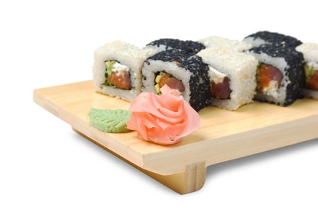 Traditional Asian food sushi on wooden plate isolated on white backgroundの写真素材