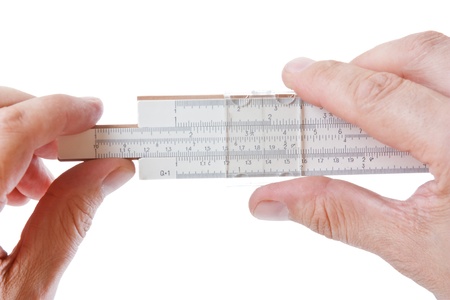 slide rule in hand  isolated on a white backgroundの写真素材