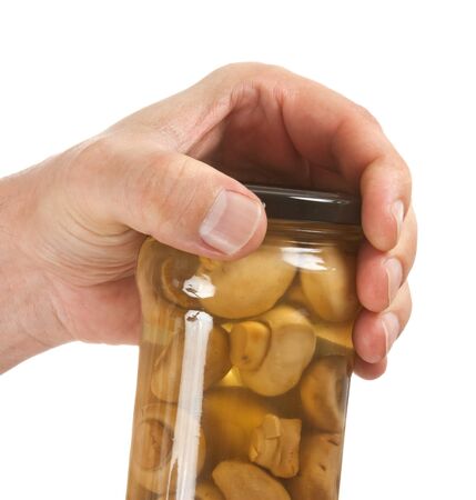 jar of canned mushrooms isolated on white backgroundの写真素材