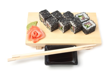 Traditional Asian food sushi on wooden plate isolated on white backgroundの写真素材