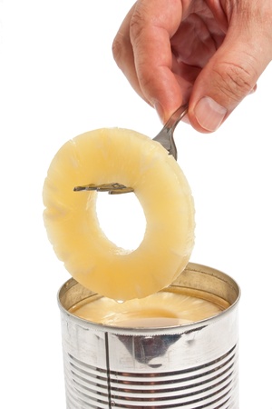 slice of pineapple on a fork  isolated on white backgroundの写真素材