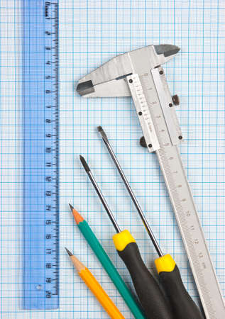 technical tools on a background of graph paperの写真素材