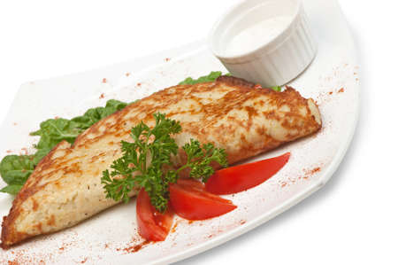 dish of pancakes with vegetables isolated on a white backgroundの写真素材