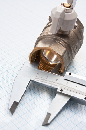 water inlet valve  on a background of graph paperの写真素材