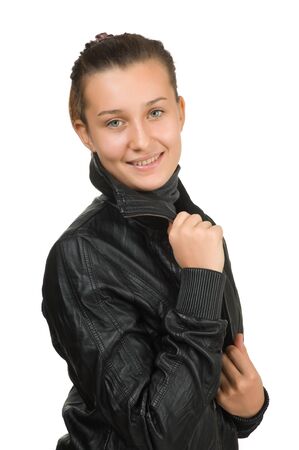 happy young girl in a black leather jacket  isolated on whiteの写真素材