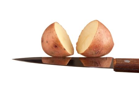 potato and a knife  isolated on white backgroundの写真素材