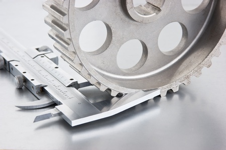 gear and callipers on a metal plateの写真素材