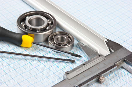 technical tools on a background of graph paperの写真素材