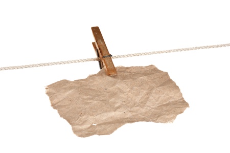 scrap of paper on a wooden clothespins  isolated on white backgroundの写真素材