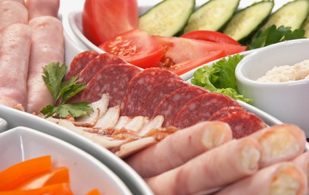 dish of assorted sausages and vegetablesの写真素材