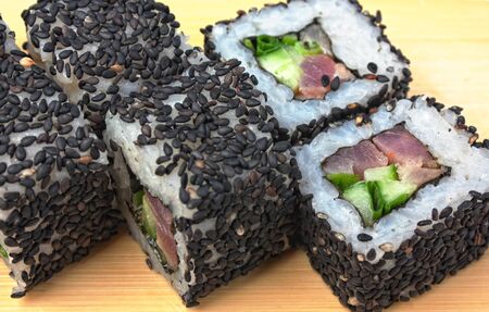 Traditional Asian food sushi on wooden plateの写真素材