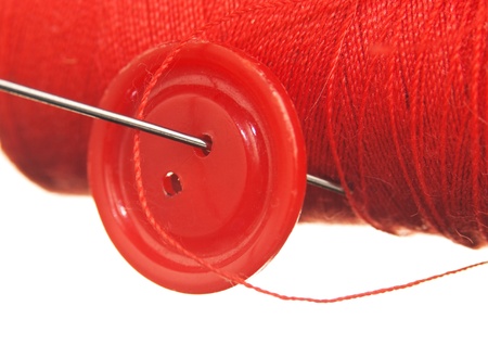 spool of thread and buttons isolated on white background