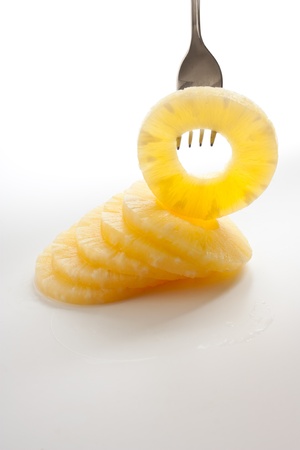 slice of pineapple on a fork の写真素材