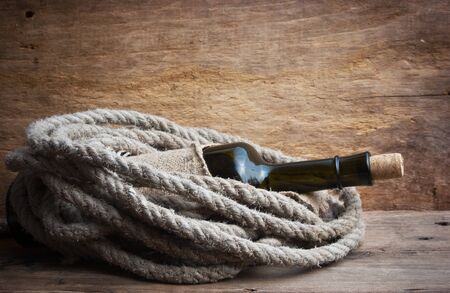 Old  bottle of wine on the boardの写真素材