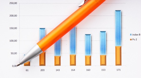 pen, magnifying glass and the working paper with a diagramの写真素材