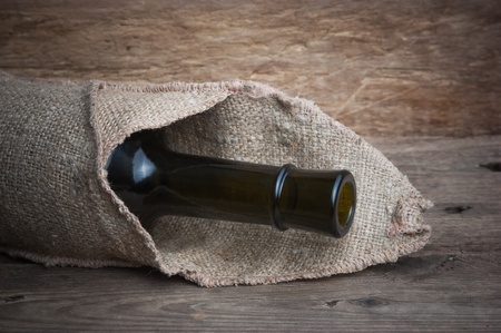 Old  bottle of wine on the boardの写真素材