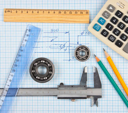 technical tools on a background of graph paperの写真素材