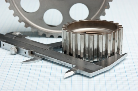 gears and caliper on graph paperの写真素材