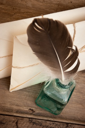 letter and a quill in the inkwellの写真素材