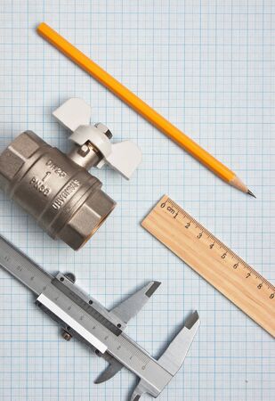 water inlet valve  on a background of graph paperの写真素材