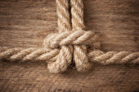 Marine knot on a wooden background