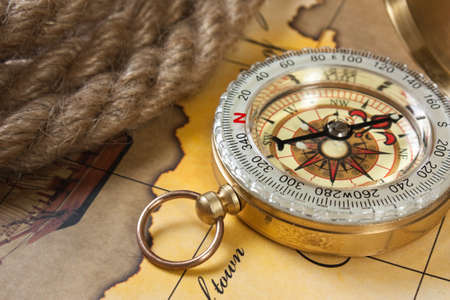compass and rope on a mapの写真素材