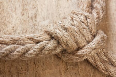 Marine knot on a wooden backgroundの写真素材