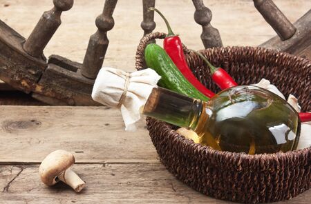 vegetables and a bottle of cooking oil in a basket